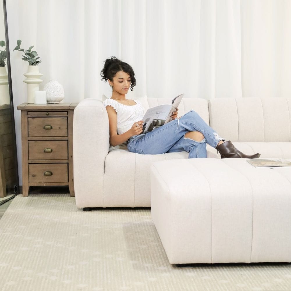 Woman relaxing on a sectional couch