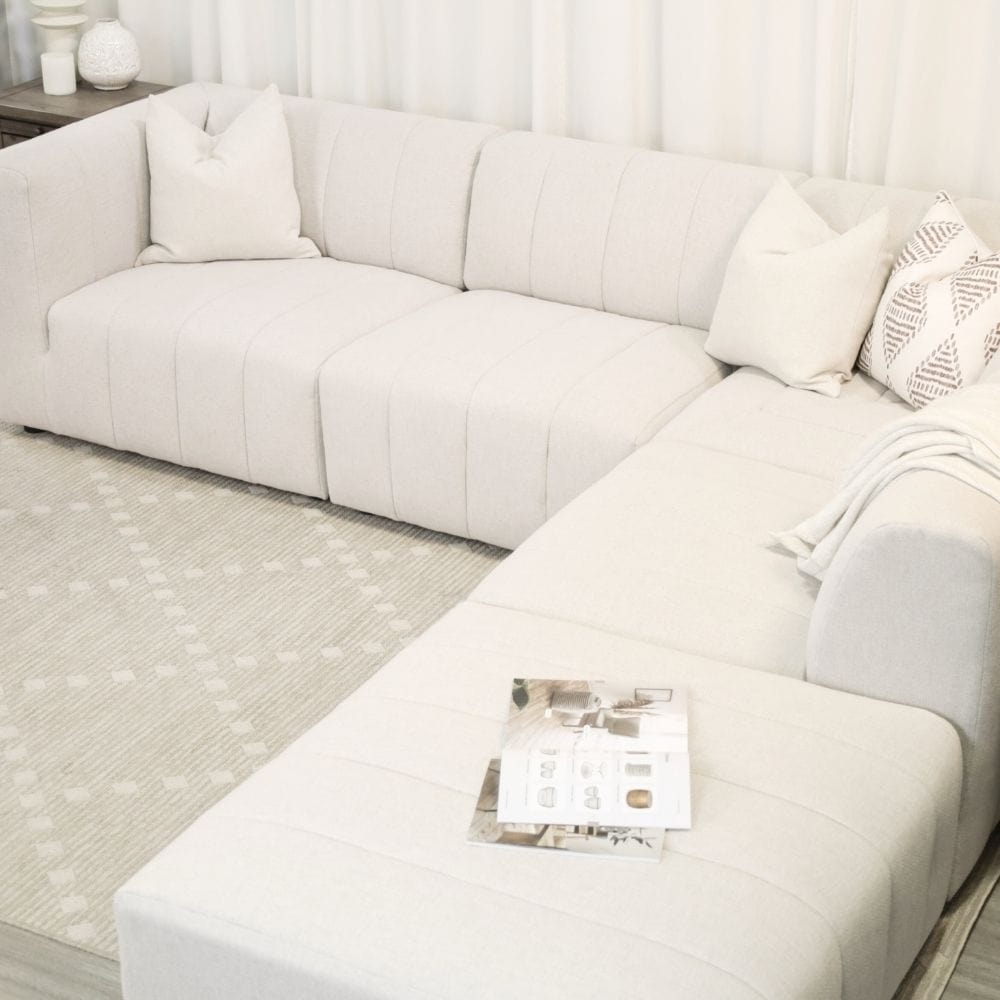 Lauriston Sectional Couch and Ottoman Knit Cream in living room